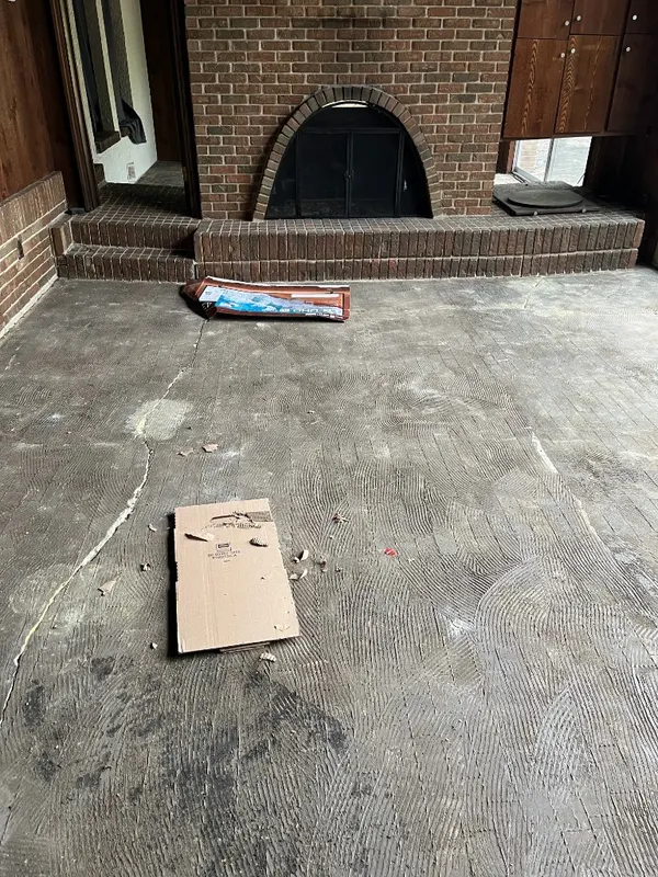 Slab Preparation — Existing slab cleaned, cracks addressed, and thinset combed out in preparation for plank tile.