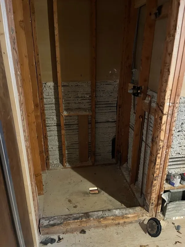 Shower Demolition & Framing — Old shower removed down to the studs — proper demo and framing before any new tile work begins.